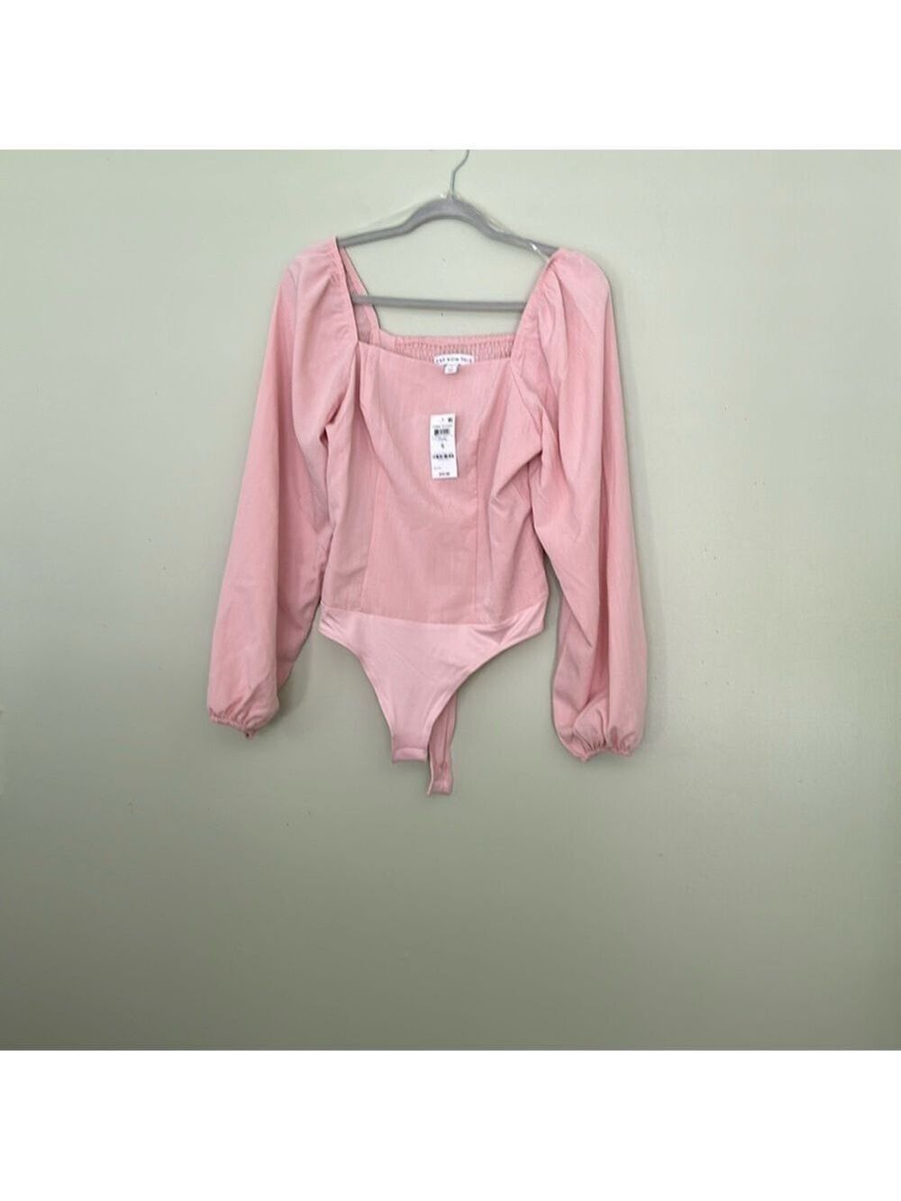 AND NOW THIS bodysuit in lotus pink